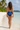High Waist Swim Bottom in Ocean Blue - Back standing pose on tropical beach