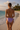 Tie Side Swim Bottom in Lavender - Back standing pose on tropical beach