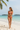 Classic Triangle Bikini Set in Coral Orange – Lifestyle beach pose